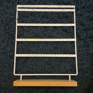 White & wood earring holder.